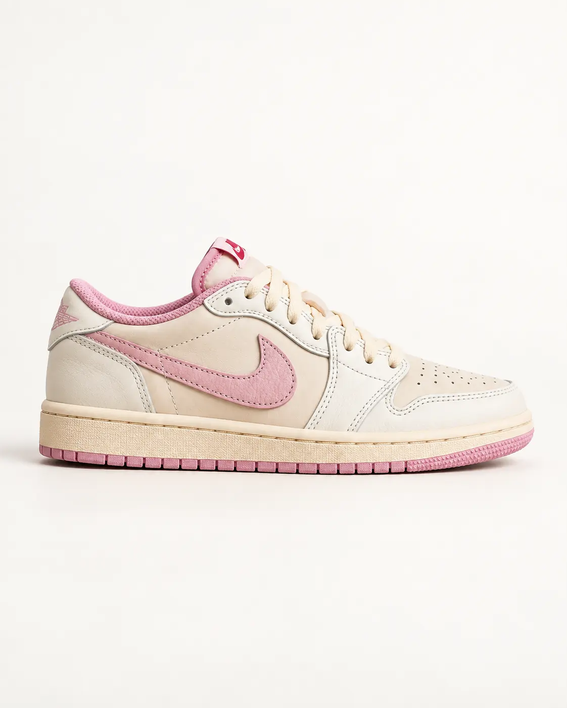 Cream and pink sneaker on a clean studio background